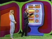 ...for a total of $108. She keeps the blender, blouse, and popper no matter what. But if they total $108 or more, she wins the trip to Spain.