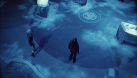 Jenny and Abby search for fire extinguishers in the frozen ops room