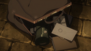 The pigeon carrier can be seen in Eric's bag (Ep. 01).