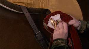 Vizzini planting fabric from a Gulider army uniform on Buttercup's horse