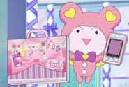 Kuma holding a PriTicket bag and a PriPass for Laala.