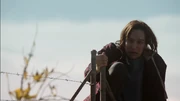 Franky escapes the police by jumping over a train fence