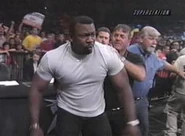 Booker T leaves the announce booth to beat on Rick Steiner.