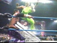 Shannon Moore running up the ladder and hitting Jamie Noble.