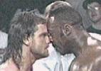 Chris Benoit and Booker T go face to face.