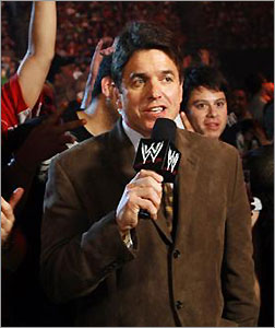 Raw General Manager Mike Adamle makes an announcement