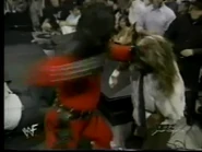 "Kane" punches Mankind