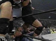 Curt Hennig backing up Konnan in the corner.