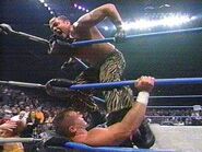 Rey Mysterio performing the Bronco Buster on Lance Storm.