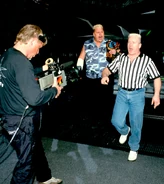 WCW Hardcore Champion, Brian Knobbs makes his way to the ring with special referee Fit Finlay