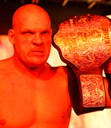 Kane with his Heavyweight Champion.