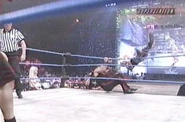 Shawn Stasiak pulls the top rope as Chavo Guerrero approaches.