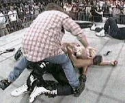 Bret Hart places Hulk Hogan on Randy Savage.