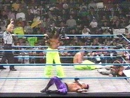 Shane Helms performing a move in the ring.