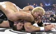 Chris Benoit applies an Indian deathlock to Sid Vicious