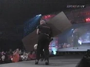 The Wall chases Shane Douglas with a table.