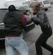 Thunder 2-18-99 1.jpg (7 KB) Elizabeth Heulette exiting the limo as Rey Mysterio slams the door on Lex Luger's arm.