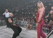 Konnan doing a crotch chop to Kevin Nash.