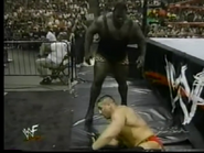 Mark Henry attacks Ken Shamrock outside the ring