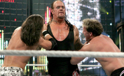 Taker double chokeslam