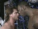 Booker T gets in the face of Chris Benoit.