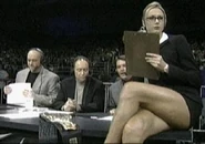 Miss Hancock sitting ringside, taking notes.