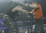 Dustin Rhodes hitting Terry Funk with a chair.