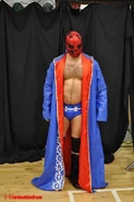 Cavanagh in making his entrance in a mask.