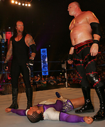 Taker and Kane destroy MVP on Smackdown.