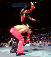 Booker T delivers an ax kick to the Disco Inferno