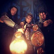 From left to right Reigns, Ambrose and Rollins as champions