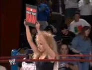 A ring girl reminding people that they are watching Monday Night RAW.