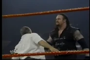 Vlcsnap-2011-09-24-21h26m28s186.png (163 KB) The Undertaker getting ready to chokeslam Pat Patterson