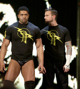 David Otunga with CM Punk on Raw in 2011.