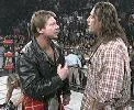 Roddy Piper confronts Bret Hart.