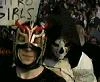 A fan in the crowd with a La Parka mask.