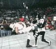 La Parka hits Psychosis with a chair.