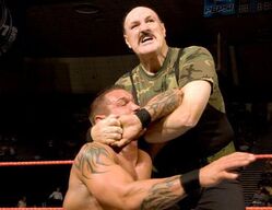 Sgt. Slaughter Applying Cobra Clutch Finisher Move on Randy Orton.jpg