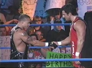 Disco Inferno shaking hands with Rey Mysterio.