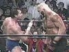 Roddy Piper does his signature two-finger poke to Hulk Hogan.