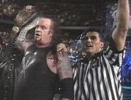 9817 - over the edge referee shane mcmahon smoking skull belt undertaker wwf