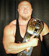 Jax Dane with the NWA World Heavyweight title.