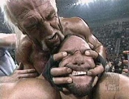 Hulk Hogan applying a vicious submission hold on Randy Savage.