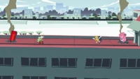 Panty and Stocking holding their weapons towards Scanty and Kneesocks on the school's roof.