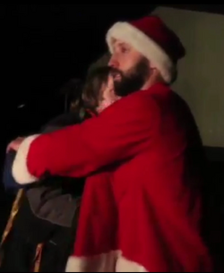 Jesse JT hugging Christmas.png