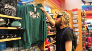 Jesse buys the green eagles Hoodie at the airport gift shop.