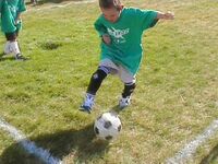 Kid playing soccer