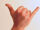 Gesture raised fist with thumb and pinky lifted.jpg