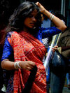 Mumbai woman in red and blue