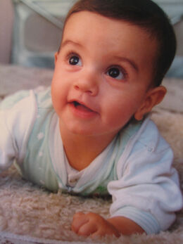 Infant looking at shiny object